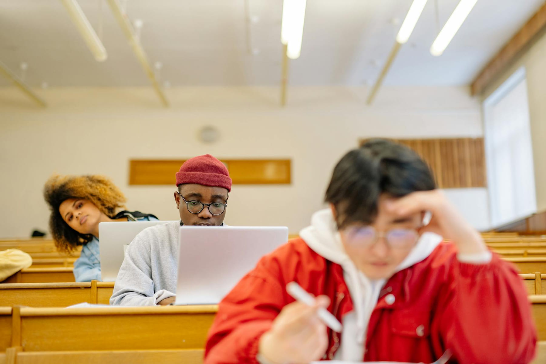 Diverse group of college students focused on studying in a university classroom setting. on The Course Compass